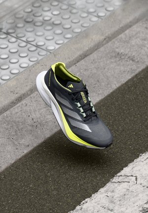 Asphalt running shoe featuring a gray mesh upper, lime green accents, three reflective stripes, and a white cushioned sole.