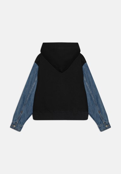 Hooded sweatshirt with black body and blue denim sleeves. Features ribbed hem and cuffs, showcasing contrasting textures and materials.