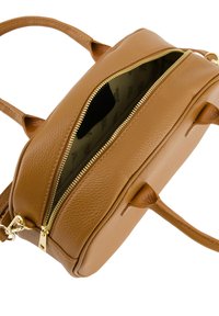 Tan leather handbag with a textured surface, gold zipper, dual handles, and an adjustable strap. Interior features a patterned lining.