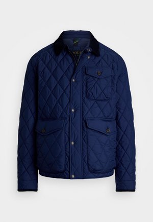 Navy quilted jacket with a corduroy collar, snap button closure, four front pockets, and a textured pattern on the fabric.