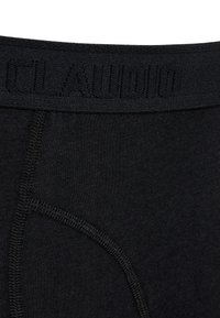 Sorte boxer briefs med et tekstureret elastisk taljebånd med prægede logo. Glat stof med kontrastsyninger og tætsiddende design.