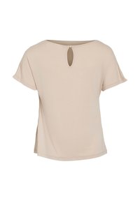 Haut beige à manches courtes avec un détail en trou de serrure au dos, tissu doux, coupe décontractée et fentes latérales pour un confort supplémentaire.
