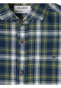 Camisa de cuadros en marino, verde, blanco y amarillo. Presenta un cuello con botones, cierre de botones de madera y logo bordado. Material de algodón.