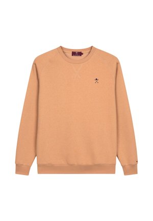 Perzikkleurige sweatshirt met een ronde hals en lange mouwen. Bevat een klein geborduurd ontwerp op de borst en ribgebreide boorden en zoom.