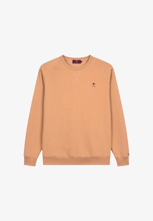 Sweatshirt couleur pêche avec un col rond et des manches longues. Présente un petit design brodé sur la poitrine et des poignets et un ourlet côtelés.