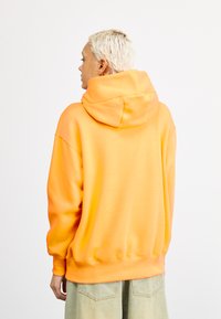 Nike Sportswear SPORTSWEAR PHOENIX FLEECE - Sportinis megztinis - sundial/sail