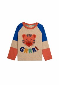 Pitkähihaista paitaa vaaleanbeige kehys ja siniset hihat, jossa on tiikeri kasvot -kuvio ja värikäs "GRRR!" -teksti brodeerattuna.