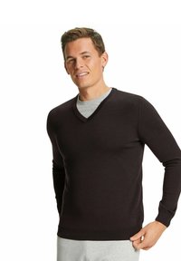 Maglione a V in marrone scuro realizzato in un tessuto lavorato a maglia liscio. Design aderente con maniche lunghe e polsini e orlo a coste.