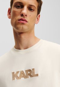 KARL LAGERFELD RELAXED LOGO ART DECO - Marškinėliai su spaudiniu - pristine