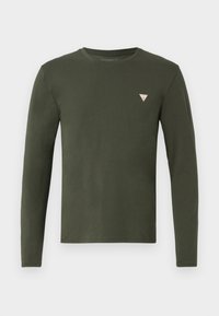 Cămașă lungă, de culoare verde măslin, confecționată din bumbac moale. Are un guler tip crew și un logo triunghiular mic pe pieptul stâng, de culoare albă și portocalie.