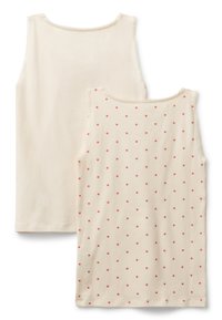 Top senza maniche in cotone color crema. Un lato presenta un colore uniforme, mentre l'altro ha un motivo di pois rossi. Collo scallop.