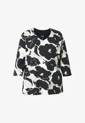 Zwart-wit bloemetjespatroon lang mouwen shirt met V-hals en losse pasvorm.