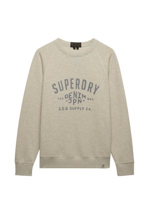 Lysebeige sweatshirt med rund hals og lange ærmer, med grå "SUPERDRY DENIM JPN S.D.G SUPPLY Co." tekst på forsiden.