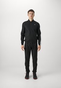 Lacoste Sport - TRACKSUIT FC - Trenirka - noir/blanc Miniaturna slika 1