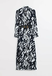 Langärmeliges, knopfbares Kleid im schwarz-weißen abstrakten Muster. Verfügt über einen Kragen und einen strukturierten Stoff; beinhaltet einen gewebten Gürtel mit einer rechteckigen Schnalle.