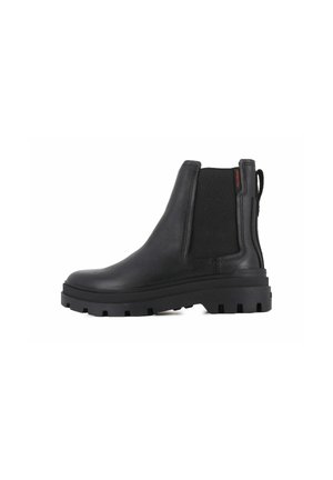 Bottines en cuir noir avec panneaux élastiques sur les côtés, semelle en caoutchouc robuste et une boucle pour faciliter l'enfilage. Fini mat sans motifs.