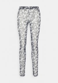 Leggings com um tecido branco e um padrão de borboletas metálicas prateadas, cintura elástica e um design ajustado que afunila nos tornozelos.