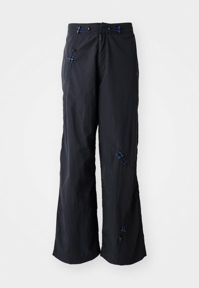 Black, lightweight, wide-leg pants with a textured finish. Features blue accents and toggles for adjustability. Zipper closure.