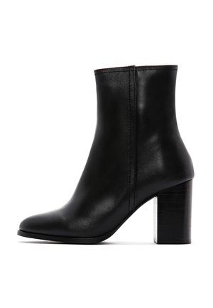 Black leather ankle boot with a pointed toe and a chunky square heel. Features smooth texture and minimal stitching details.