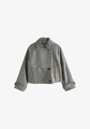 Trumpas švarkas tamsiai mėlynos ir smėlio spalvos languoto audinio, su dideliu apykakliu, dviem priekinėmis kišenėmis ir sagtelių akcentais ant rankovių.