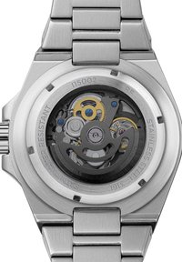 RVS horloge achterkant met een doorzichtige weergave. Zichtbare tandwielen en mechanismen in goud, blauw en zilver, gelabeld met details over waterbestendigheid.