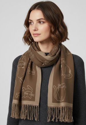 Brown patterned scarf with cat motifs, fringed edges, and a soft texture, worn over a dark sweater.