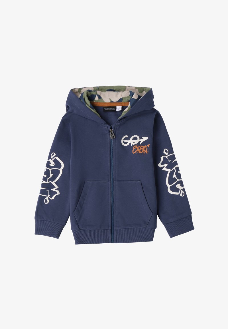 Felpa con zip navy e cappuccio foderato in camo. Presenta testo in stile graffiti bianco e due tasche frontali. Realizzata in morbido tessuto misto cotone.