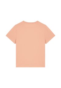 Korte mouwen T-shirt in pastel perzikkleur, gemaakt van zachte katoen. Beschikt over een klassieke ronde hals en een schone, naadloze achterkant.