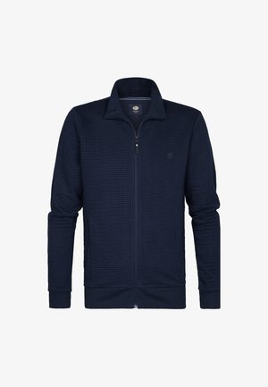 Námořnická mikina na zip vyrobená z texturované látky; má stojáček a dlouhé rukávy se manžetami. Minimální logo na hrudi.