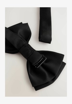 Black mesh bow tie with a textured finish, featuring a flat strap and a black adjustable buckle, positioned against a light background.