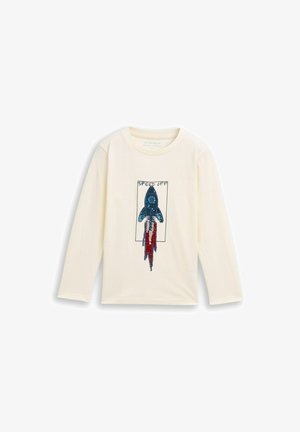 Long-sleeve cream t-shirt featuring a sequin rocket design in blue and red with the text "SPEED OFF" above. Soft cotton material.