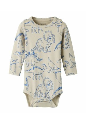 Beżowe body niemowlęce z długim rękawem z niebieskimi ilustracjami dinozaurów oraz zatrzaskami na dole ułatwiającymi zmianę pieluszki.