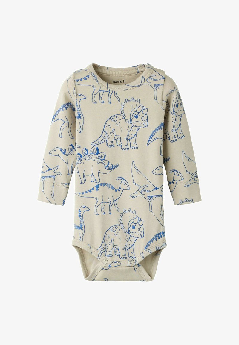 Body beige à manches longues pour bébé avec illustrations de dinosaures bleus et pressions en bas pour faciliter le changement de couche.