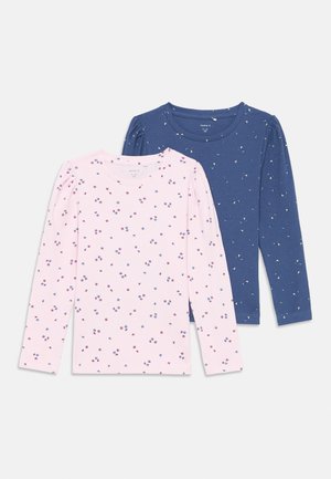 Set of two long-sleeve shirts: one pink with small floral patterns and one dark blue with similar motifs. Soft cotton fabric, round necklines.