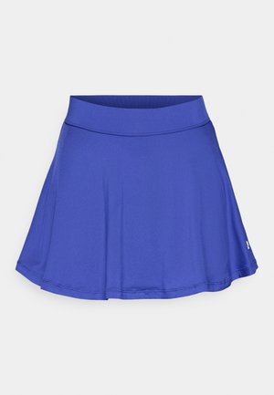 Blue athletic skort with a fitted waistband and flared A-line design. Made from smooth, stretchy fabric, features subtle logo detail on hem.