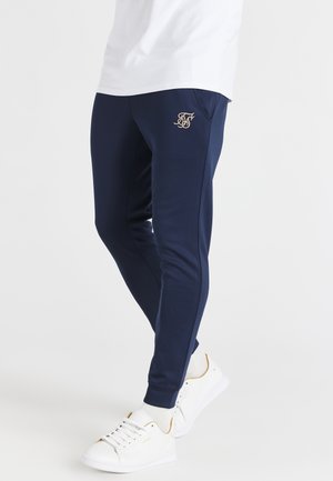 DIVISION - Pantaloni sportivi - navy & rose gold