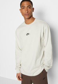 Nike Sportswear PREM ESSNTL SUST - Camisola de manga comprida - light bone/black