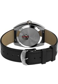 Stainless steel case watch with a transparent back, black leather strap, and silver hardware. Features an automatic movement and visible gears.