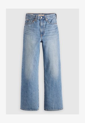 Jeans in denim blu chiaro a gamba larga con vita alta, aree sbiadite, cinque tasche e cuciture a contrasto. Classico bottone e chiusura con zip.
