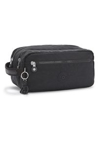 Black fabric travel bag with two zip compartments, a side handle, and a small keychain accent. Features a circular logo on the front.