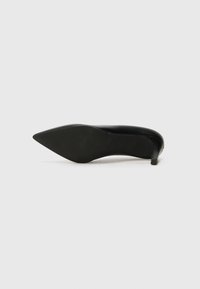 Black high-heeled shoe made of smooth leather. Features a pointed toe and a slim stiletto heel with a textured sole. Simple and sleek design.