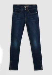 Světlé džíny z tmavého denimu se slim fit střihem, s zipem na kotnících a standardním pěti-kapsovým designem. Zesílené švy po celém obvodu.