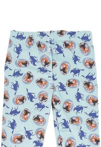 Lichtblauwe broek met herhaalde patronen van twee vrouwelijke cartoonfiguren en effen blauwe paarden silhouetten.