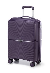 Purple hard-shell suitcase with ribbed texture, dual wheels, and a retractable handle. Features a zipper closure and brand logo.
