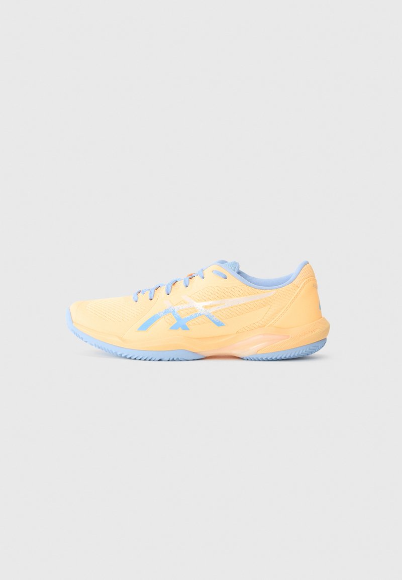 Light yellow athletic shoe with blue accents, breathable mesh upper, textured sole, and a secure lace-up design.