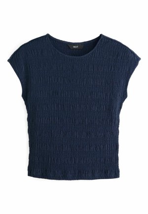 Navy blue top with soft, textured fabric featuring a crinkled pattern. It has a round neckline and short sleeves, relaxed fit.