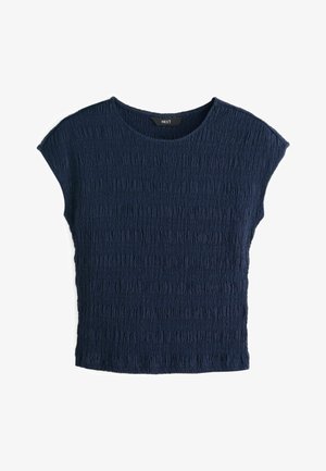 Navy blue top with soft, textured fabric featuring a crinkled pattern. It has a round neckline and short sleeves, relaxed fit.