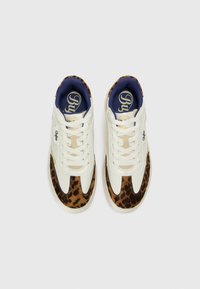 White and brown leopard-print sneakers with a smooth leather upper, lace-up front, cushioned blue interior, and logo detail on the side.