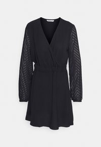 Robe mini noire à manches longues avec des manches en tulle à motif chevron, taille élastiquée et décolleté en V à l'avant.