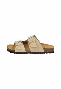 Beige suede sandals with two adjustable silver buckles, cork footbed, and textured black rubber sole. Open-toe design.